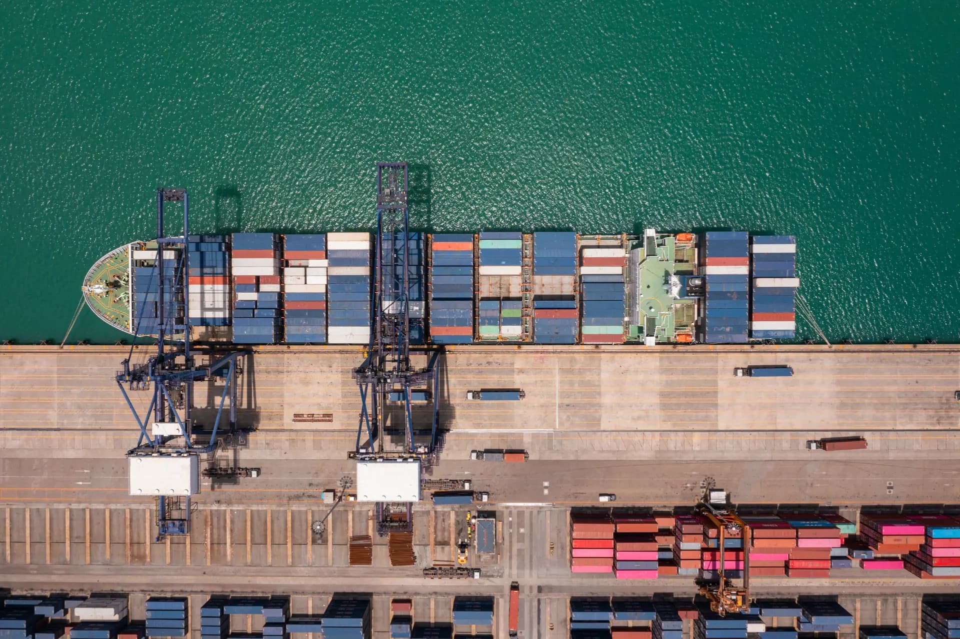 A general cargo ship alongside a quay, seen from above