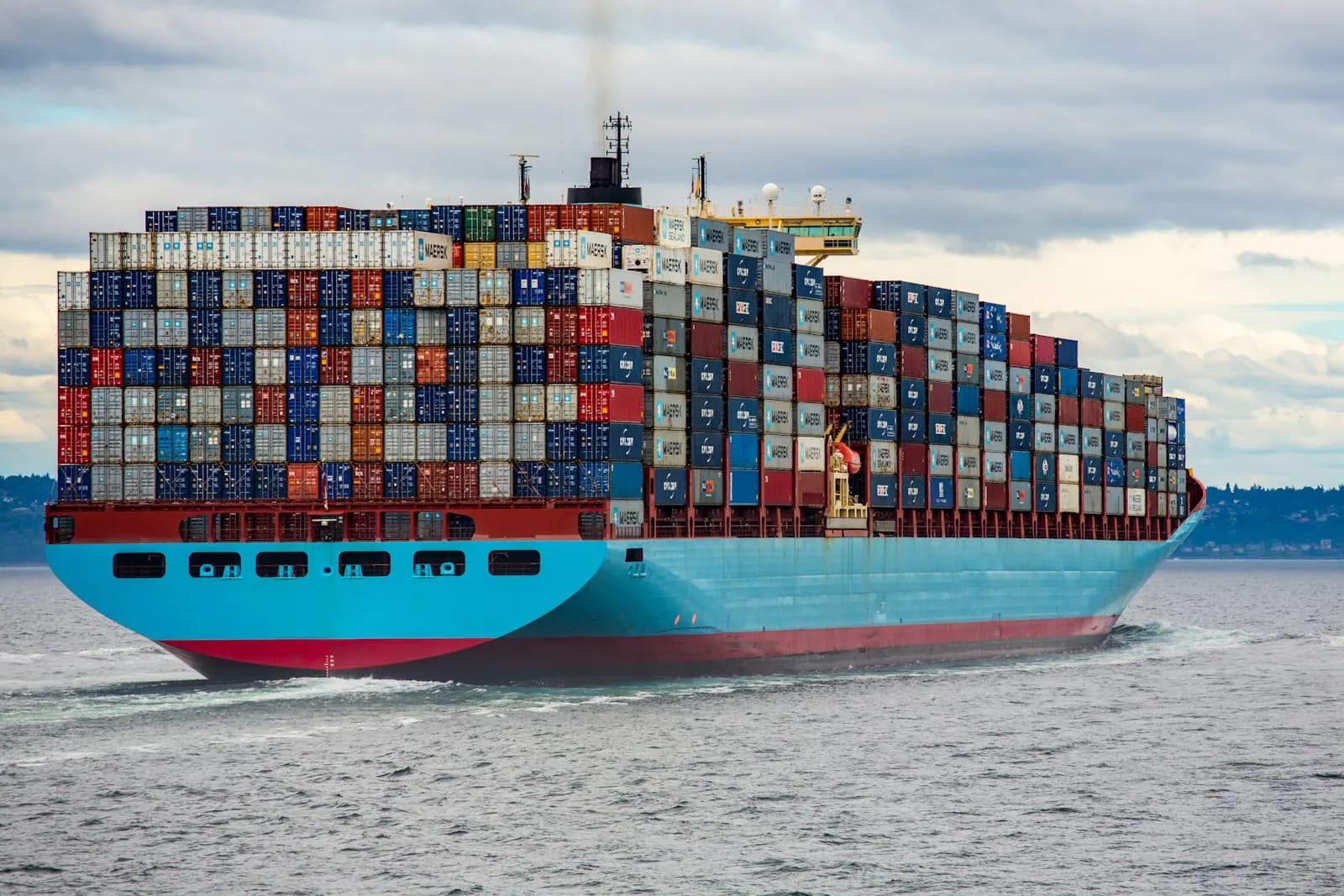 Large green-hulled LNG-powered containership underway
