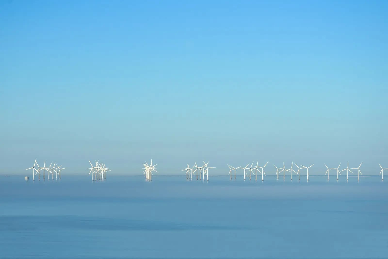 Offshore wind turbines standing in open water