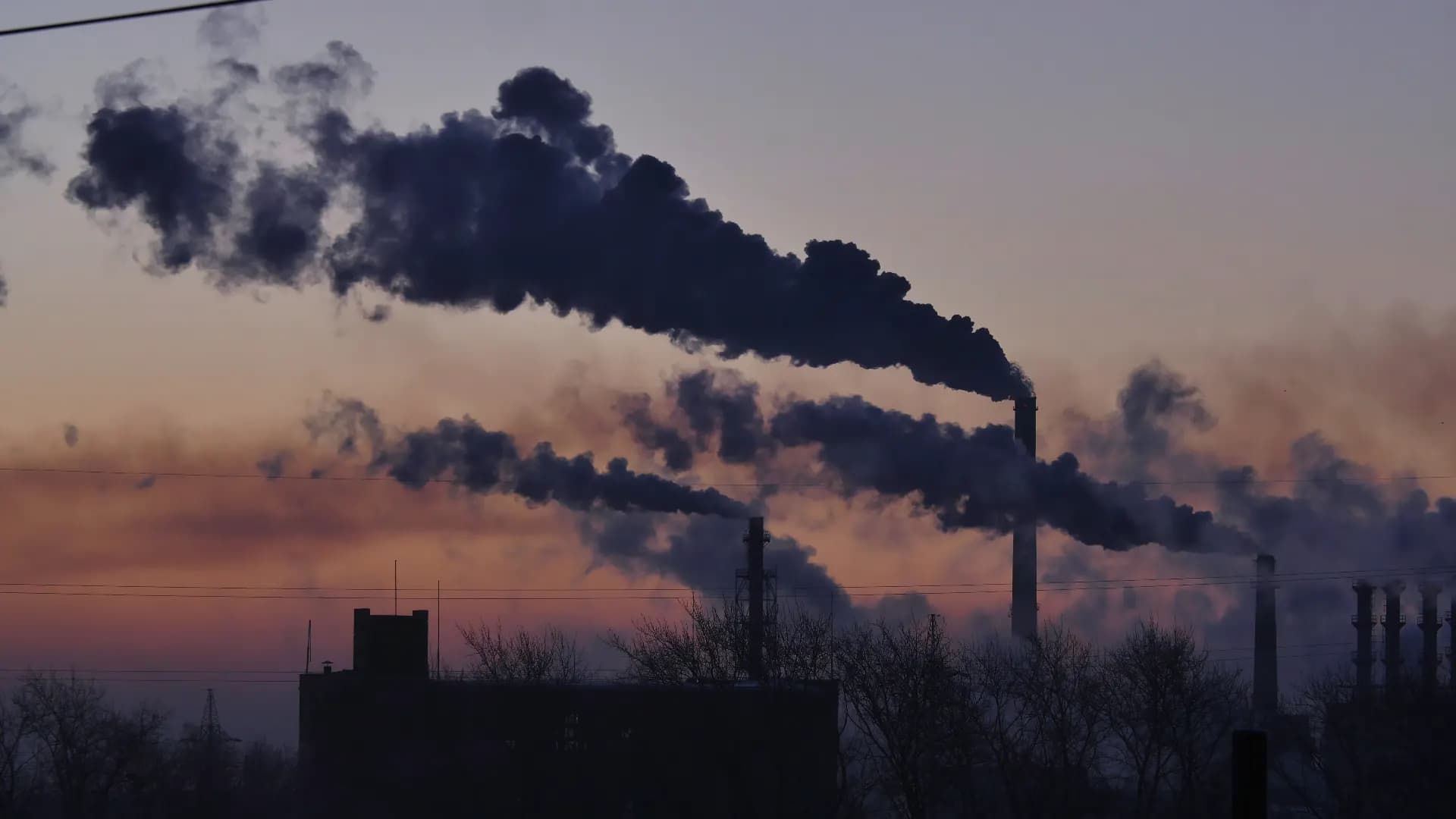 Industrial chimneys venting smoke at a chemical plant