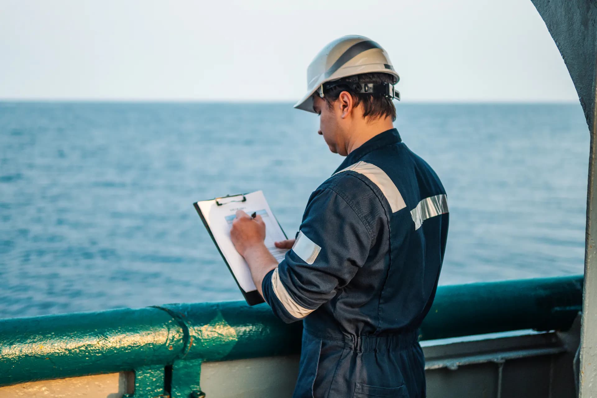Crew member at work on board a vessel at sea