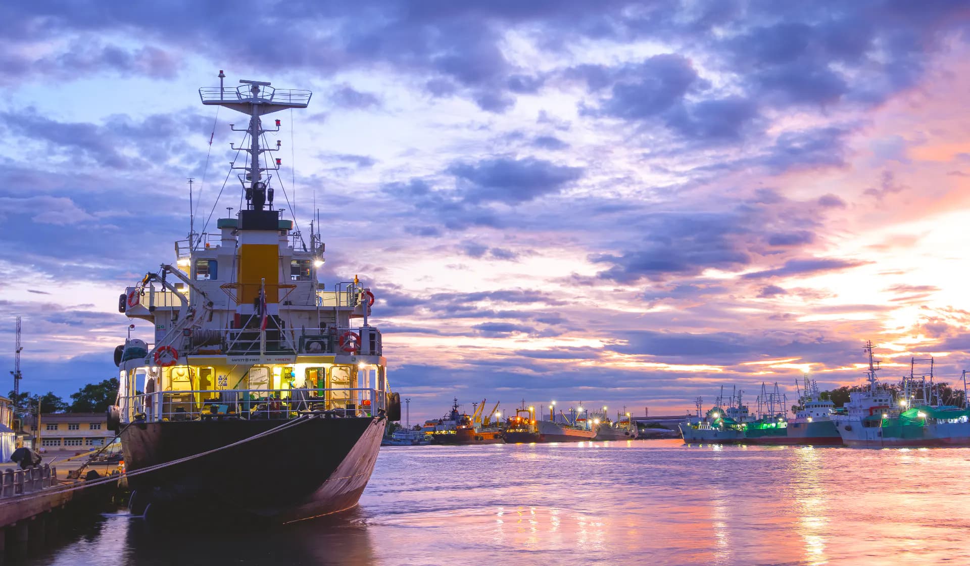 An oil tanker moored alongside other vessels