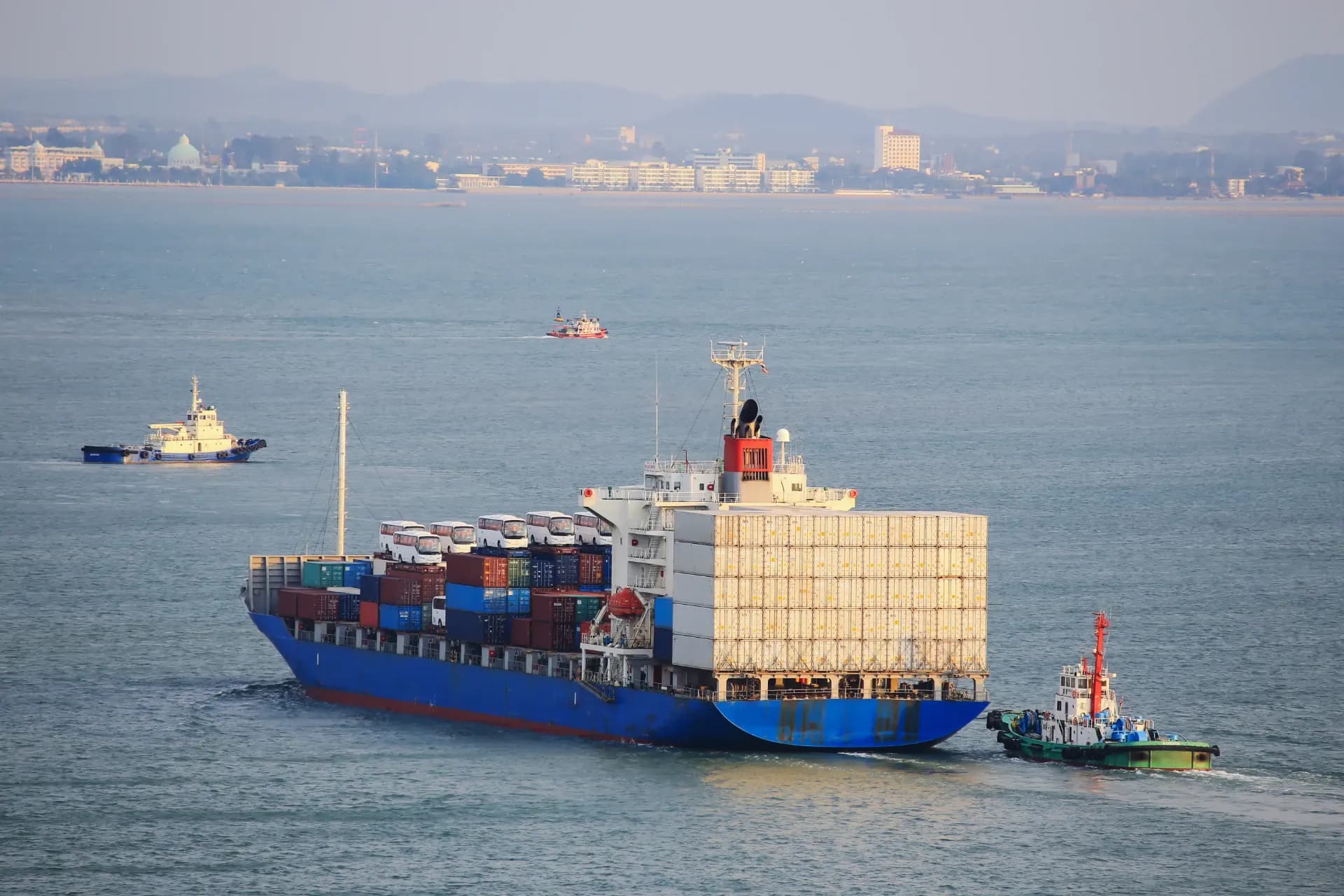 A cargo ship loaded with containers at sea