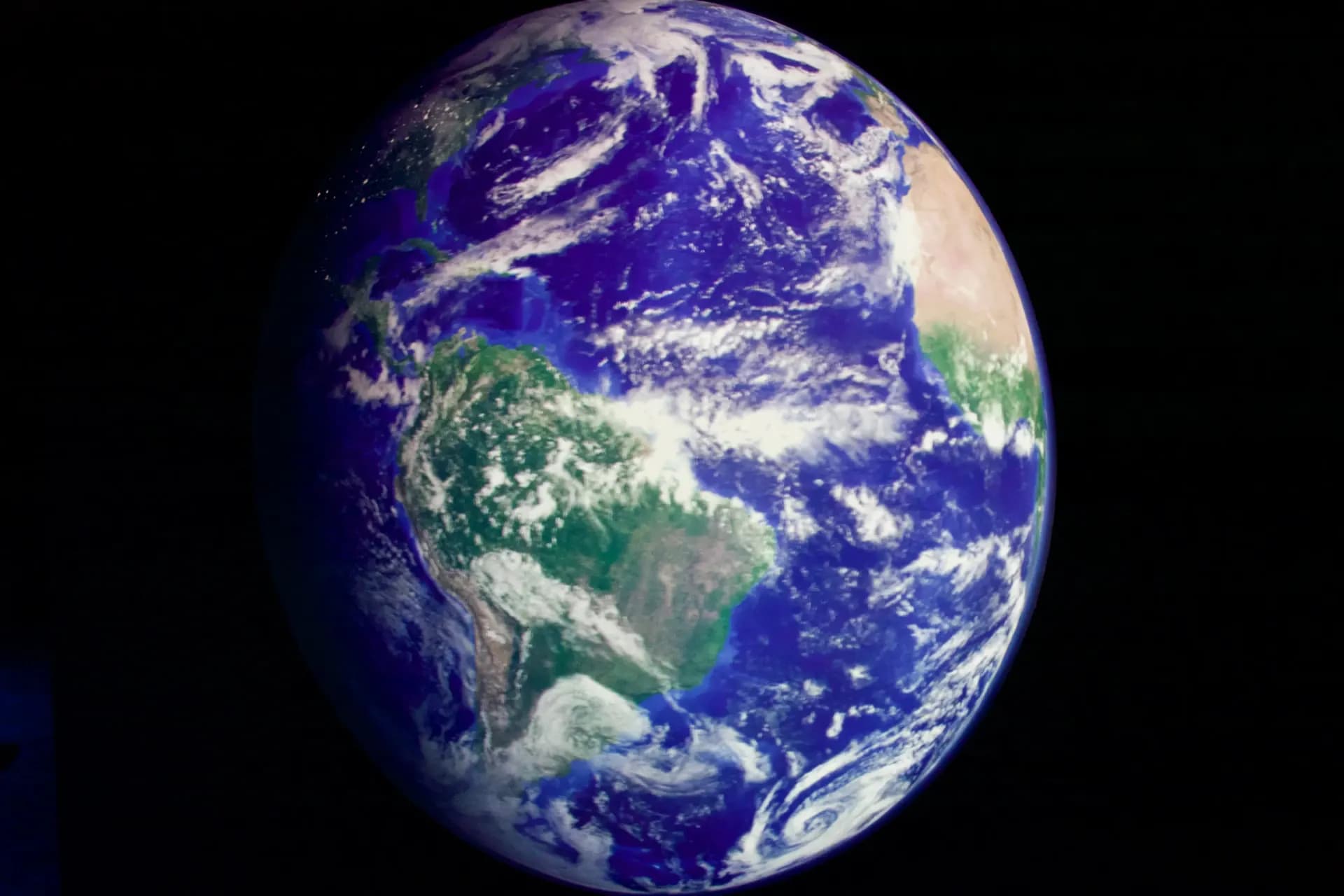 The Earth seen from space against a black background