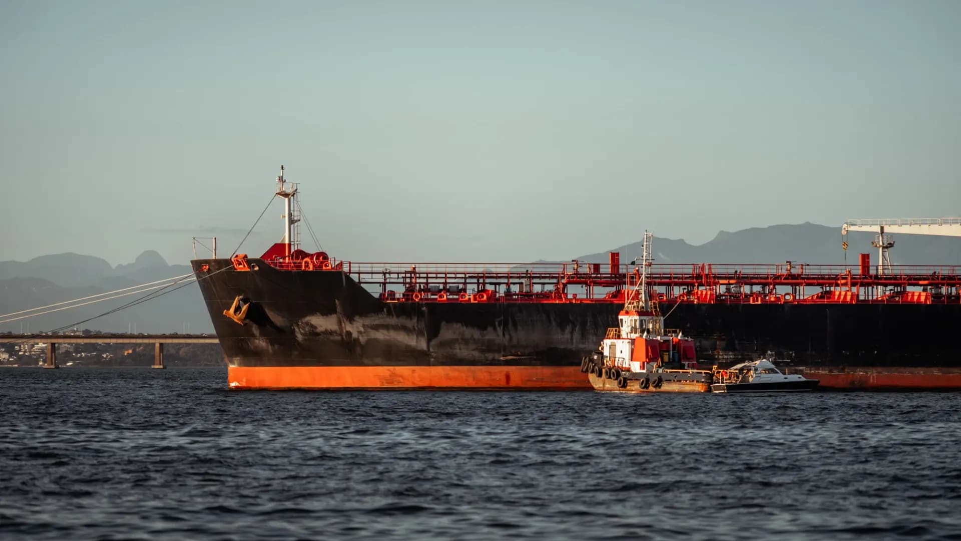 Laden crude tanker aground near a rocky coastline