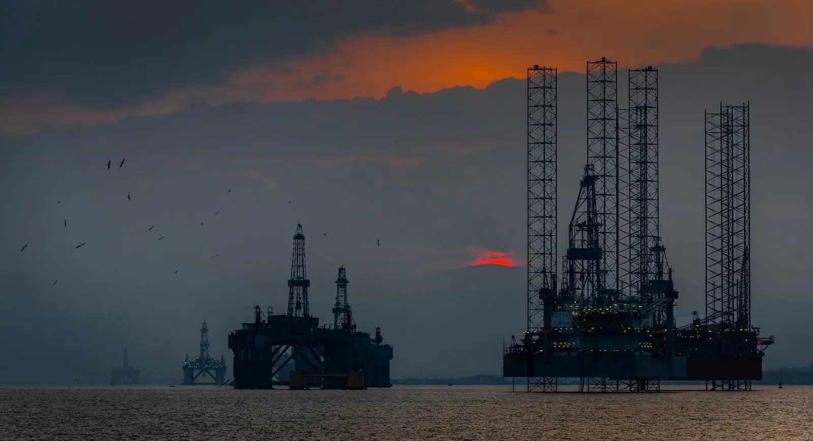 A group of offshore oil rigs at sea