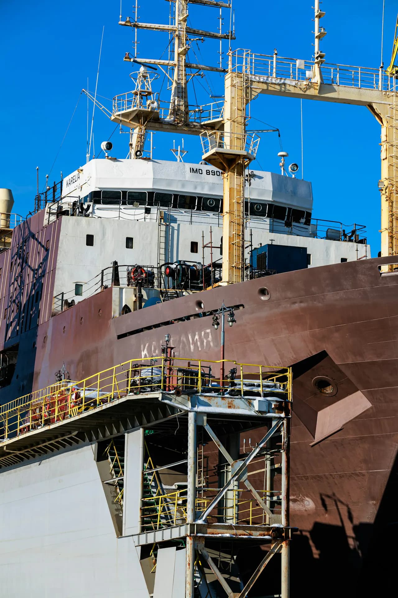 A bulk carrier vessel moored at a shipyard