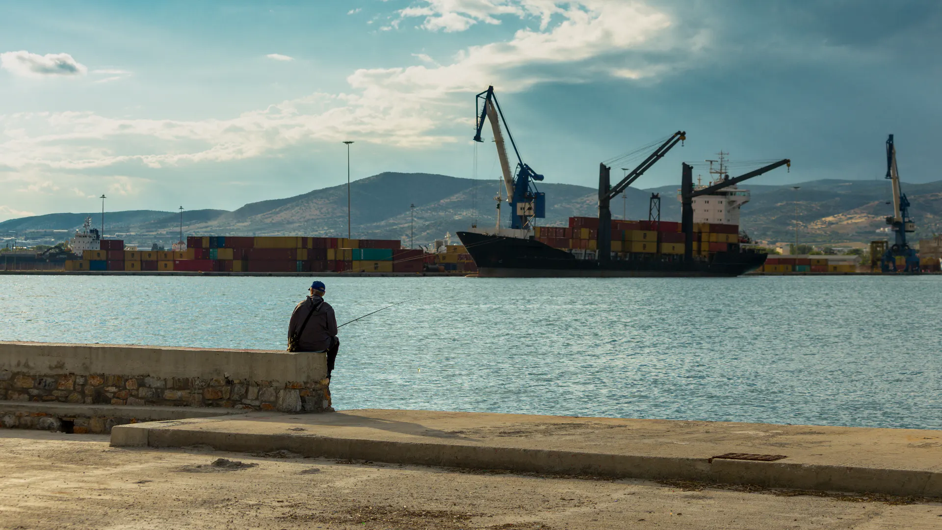 Fishing vessels moored alongside an industrial dock