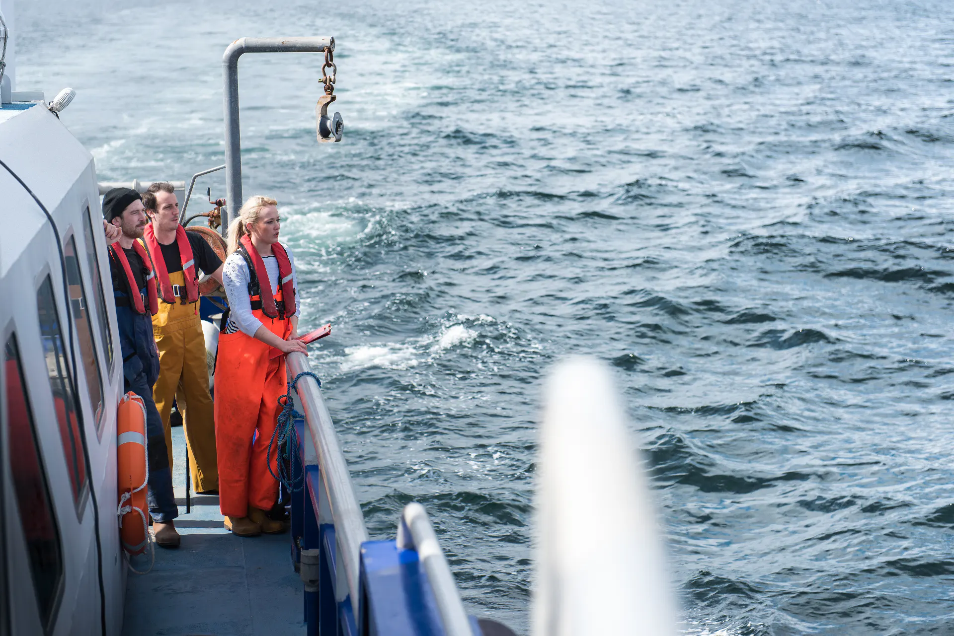 Researchers on the deck of a polar research vessel