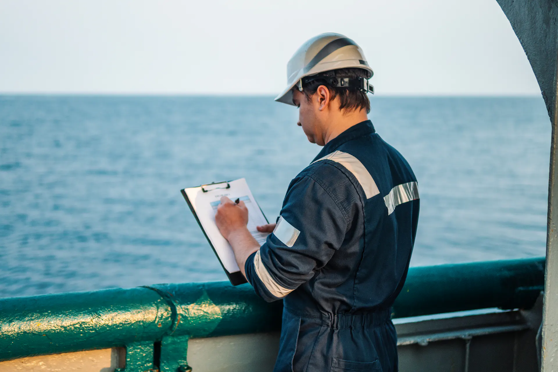 Crew member at work on board a vessel at sea