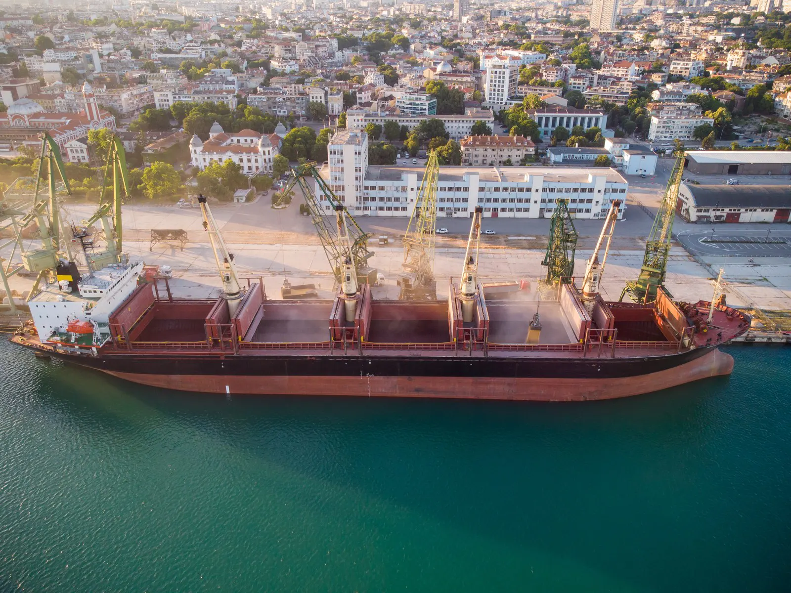 Bulk carrier loading alongside at a port