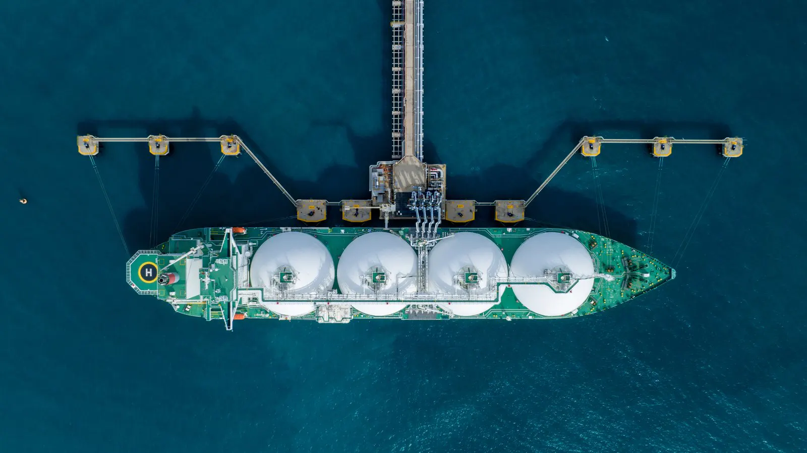 LNG carrier alongside a jetty seen from above