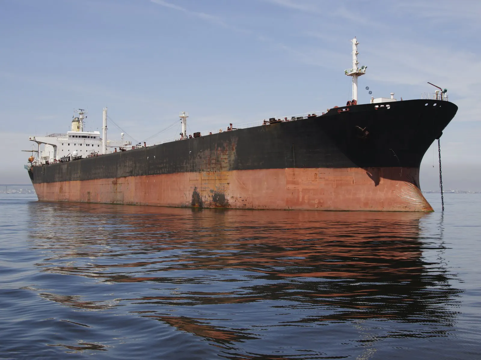 Weathered tanker lying at anchor