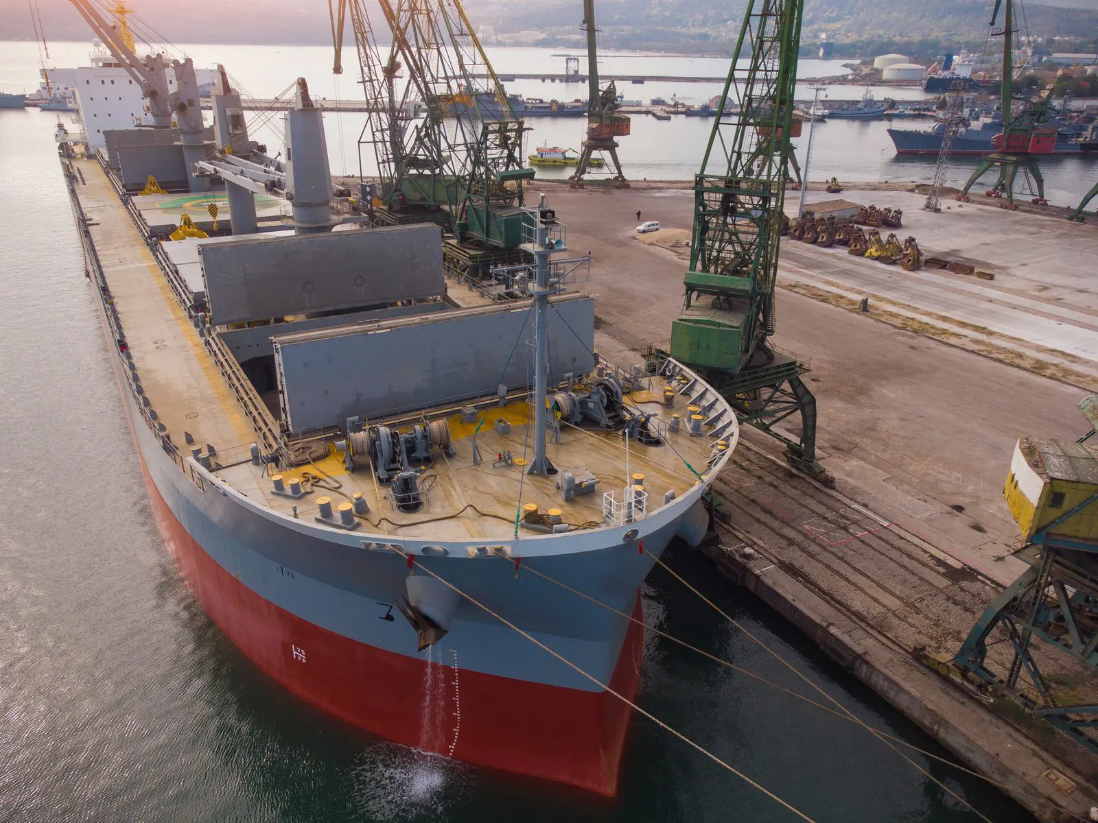 Bulk carrier loading alongside a quay with cranes