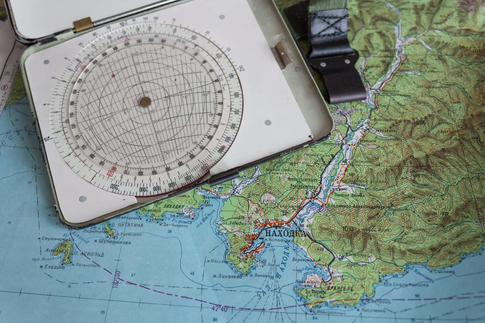 Navigational chart with compass and plotting instruments