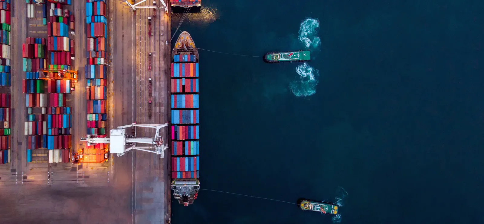Aerial view of a large container ship at a terminal