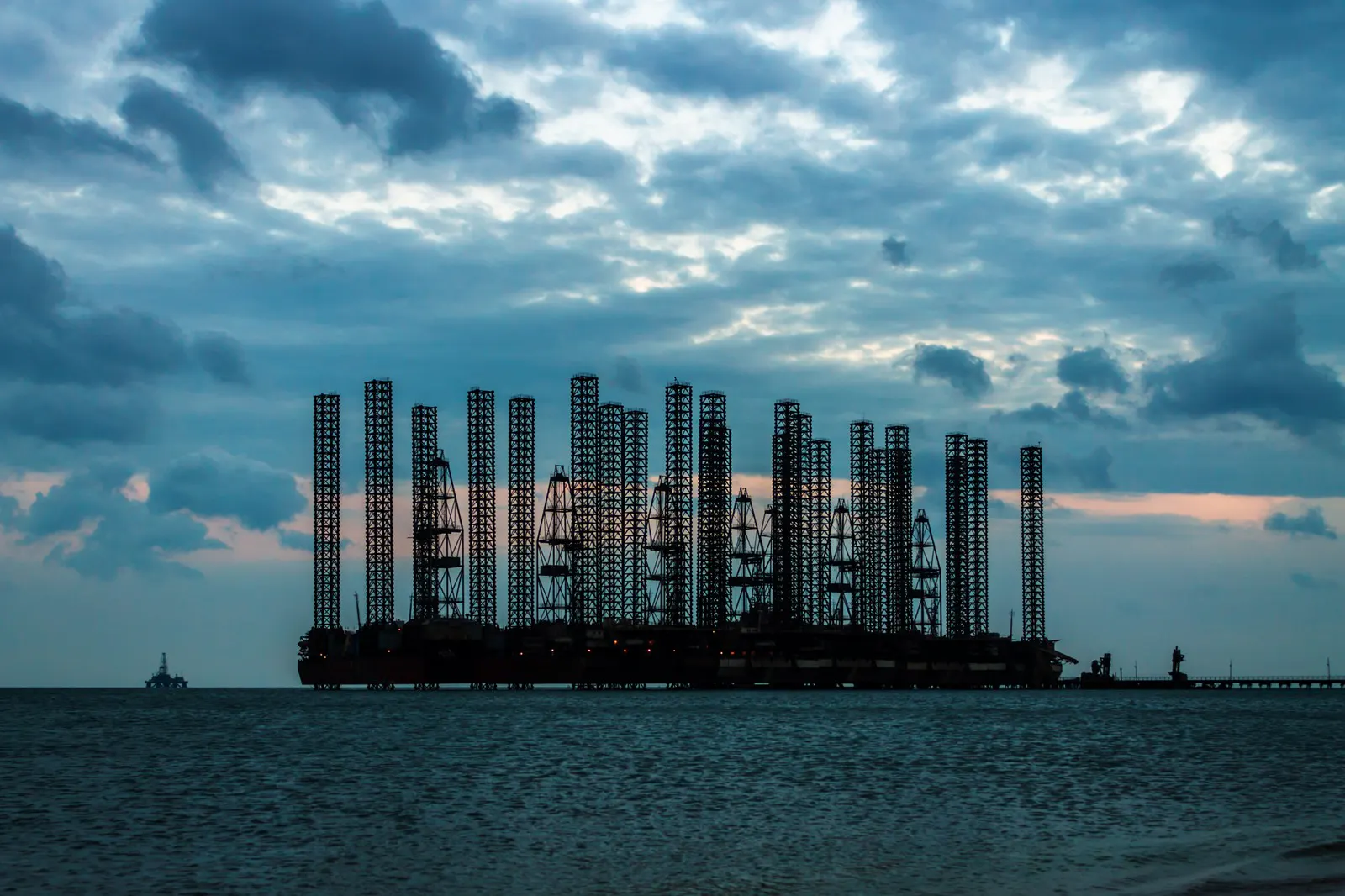 Offshore platform at sea under an evening sky