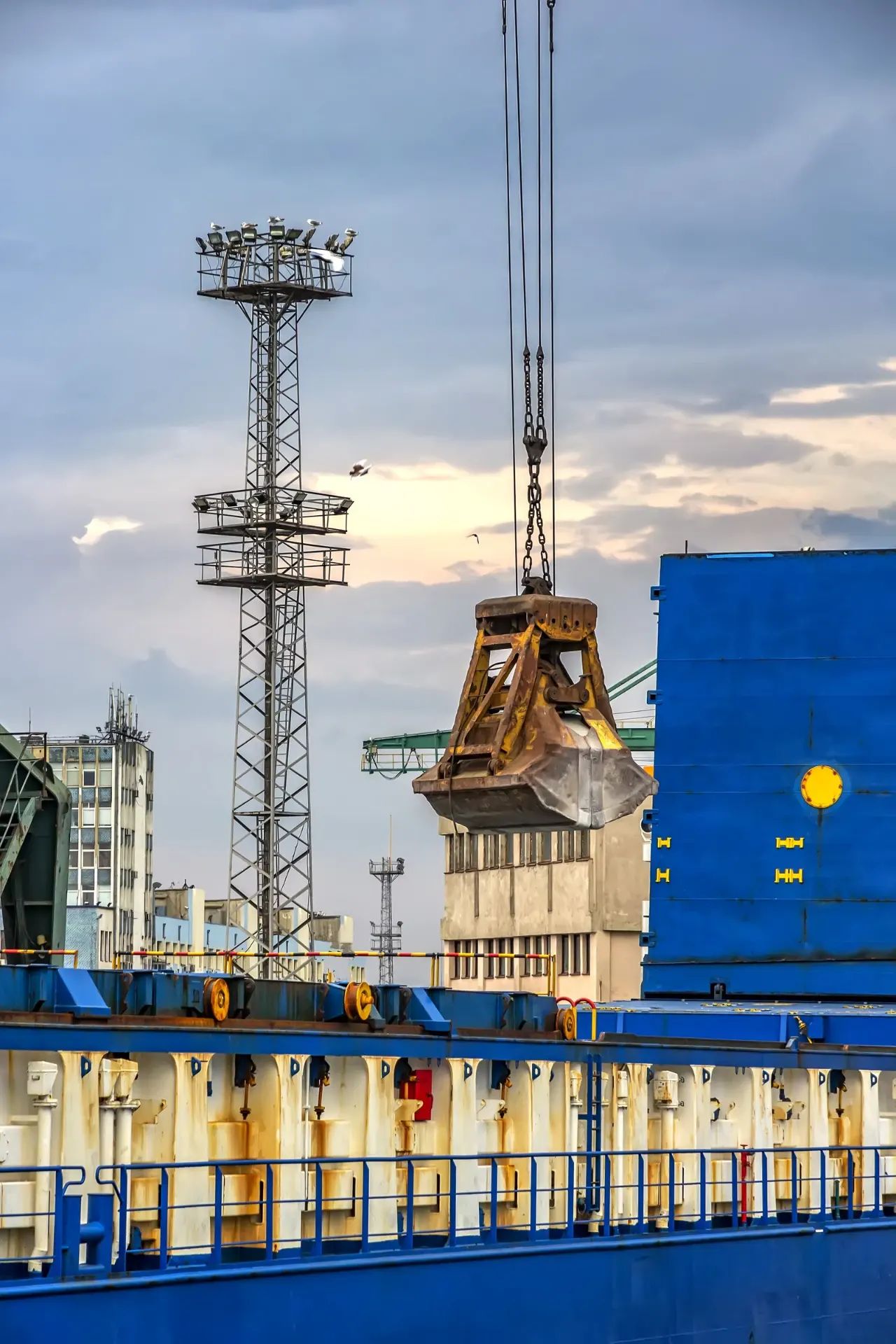 Port crane lifting a heavy load