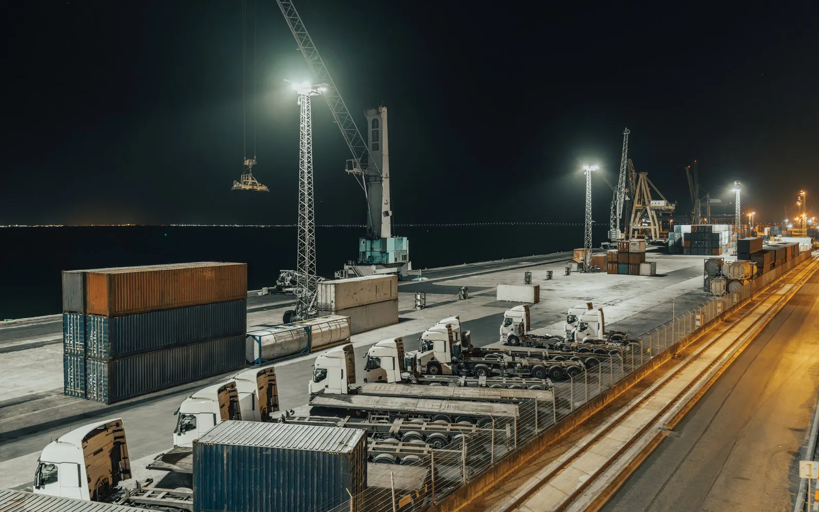 Container port at night with cranes