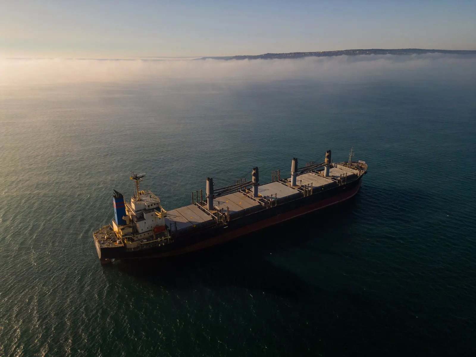 Bulk carrier at sea in hazy conditions