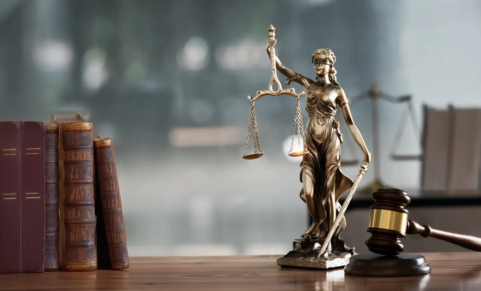 Statue of justice with scales and gavel