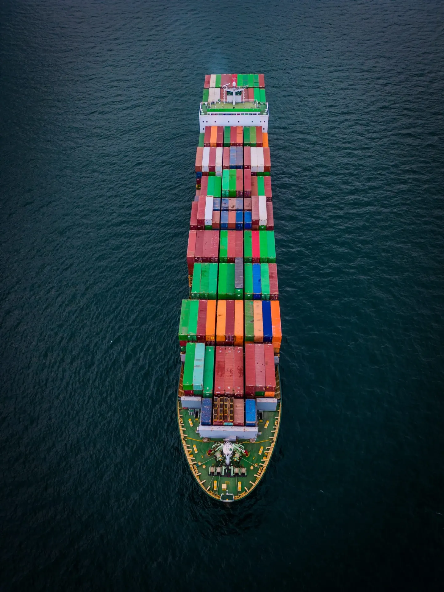 Aerial view of a fully loaded container ship at sea