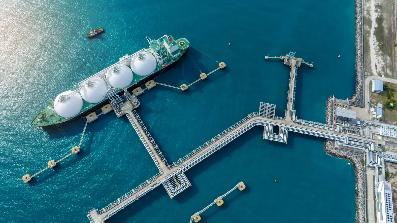 An LNG carrier moored at a gas terminal jetty