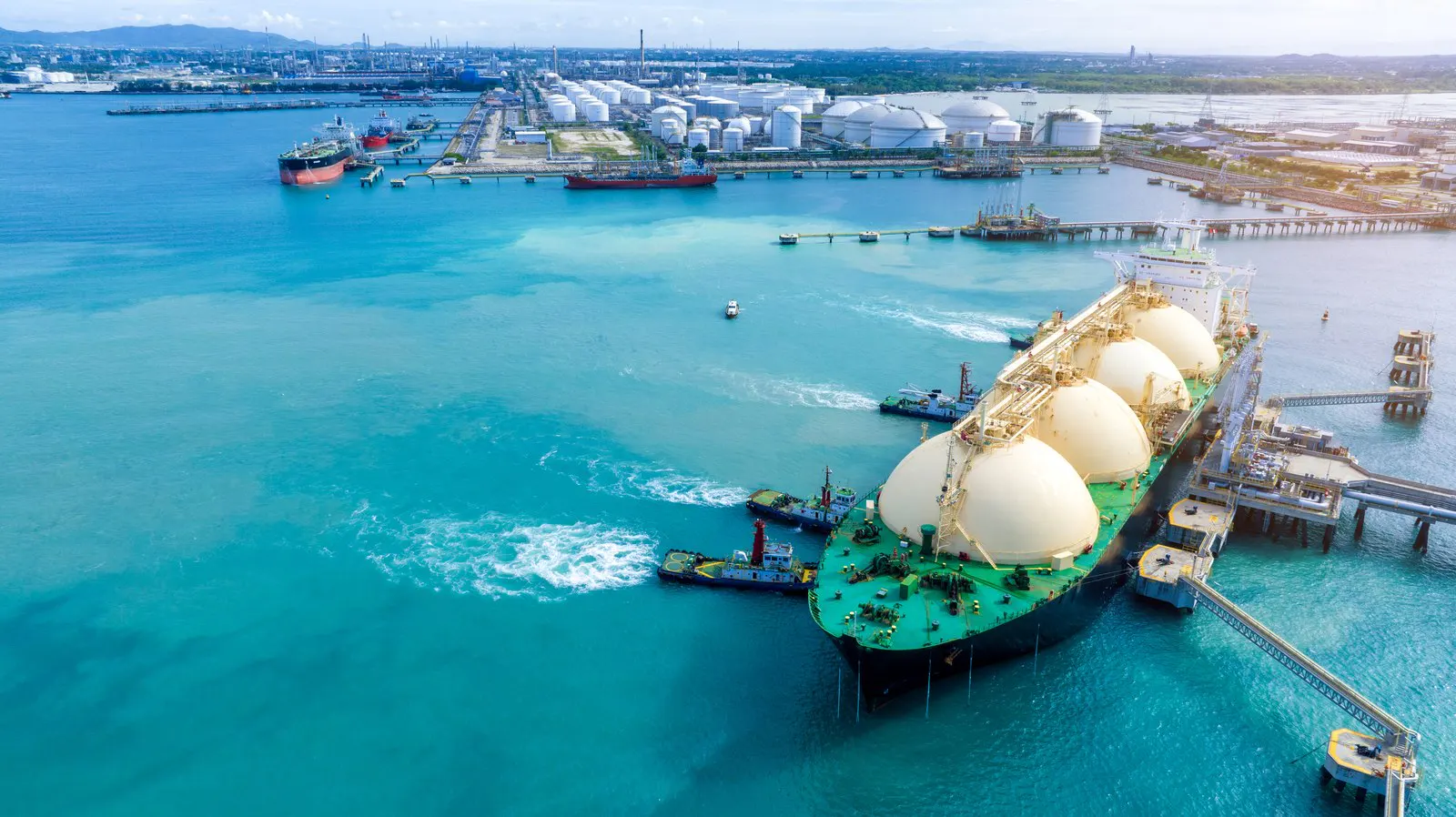 An LNG carrier alongside a liquefied natural gas terminal