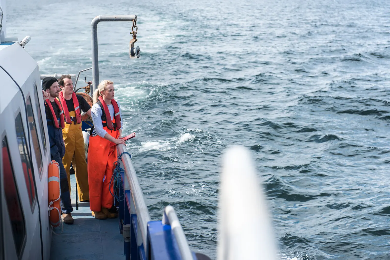 A survey crew on the deck of a research vessel