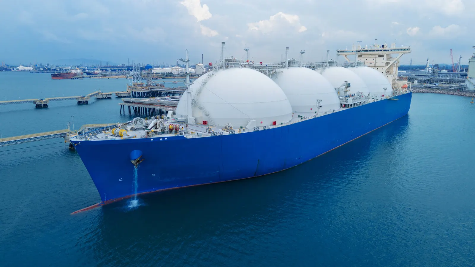 An LNG carrier alongside a gas terminal