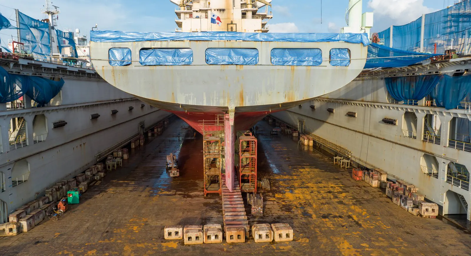 A ship sitting in a dry dock