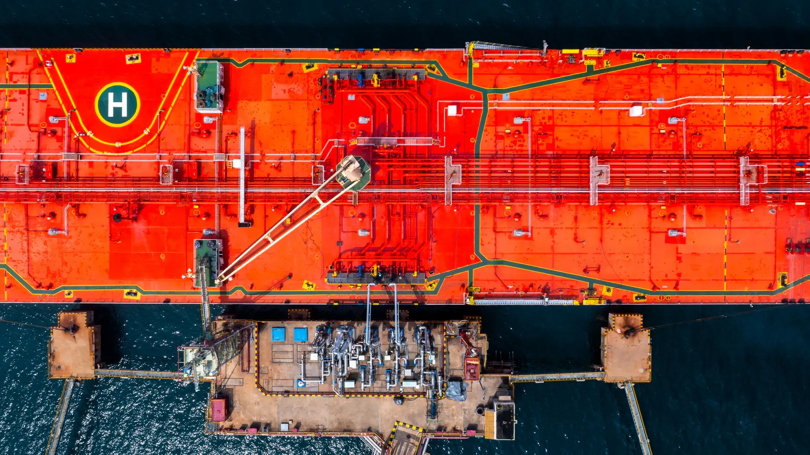 Aerial view of a red tanker's deck and manifold