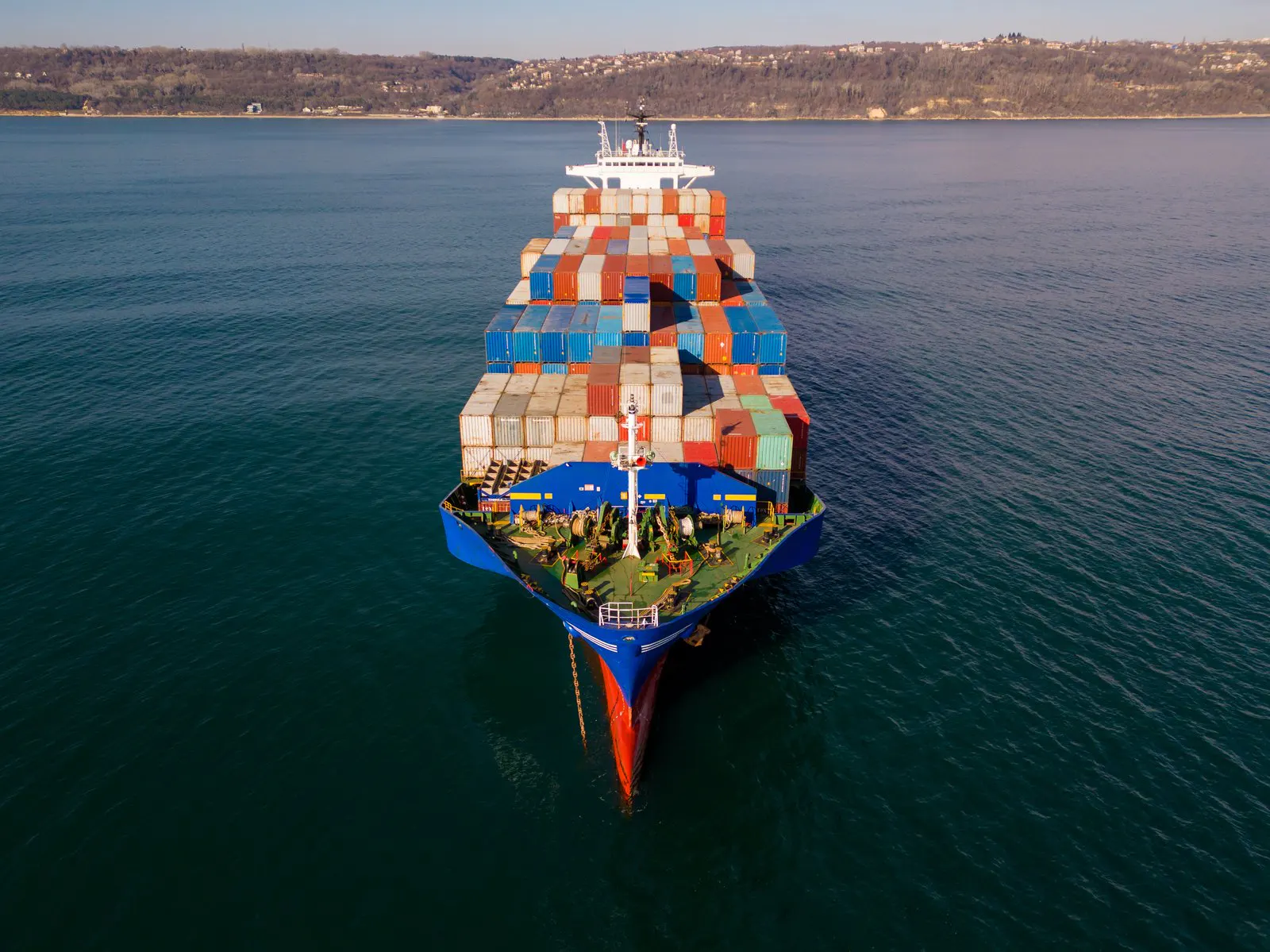 Aerial view of a container feeder at sea