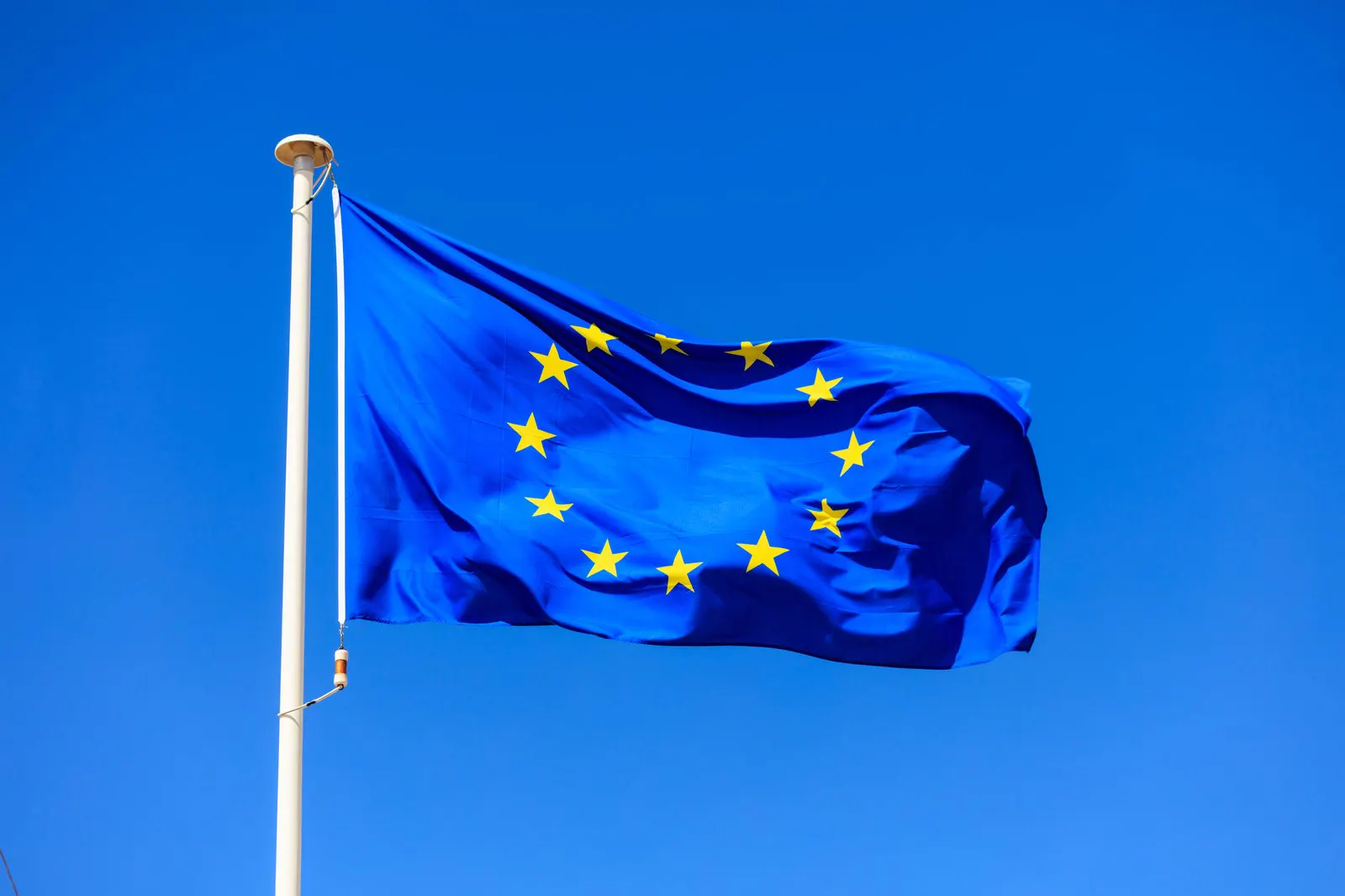 European Union flag flying against a clear blue sky