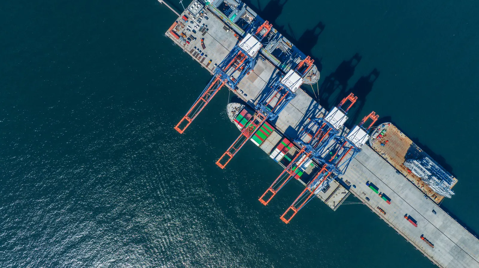 Container ship alongside a terminal berth seen from the air