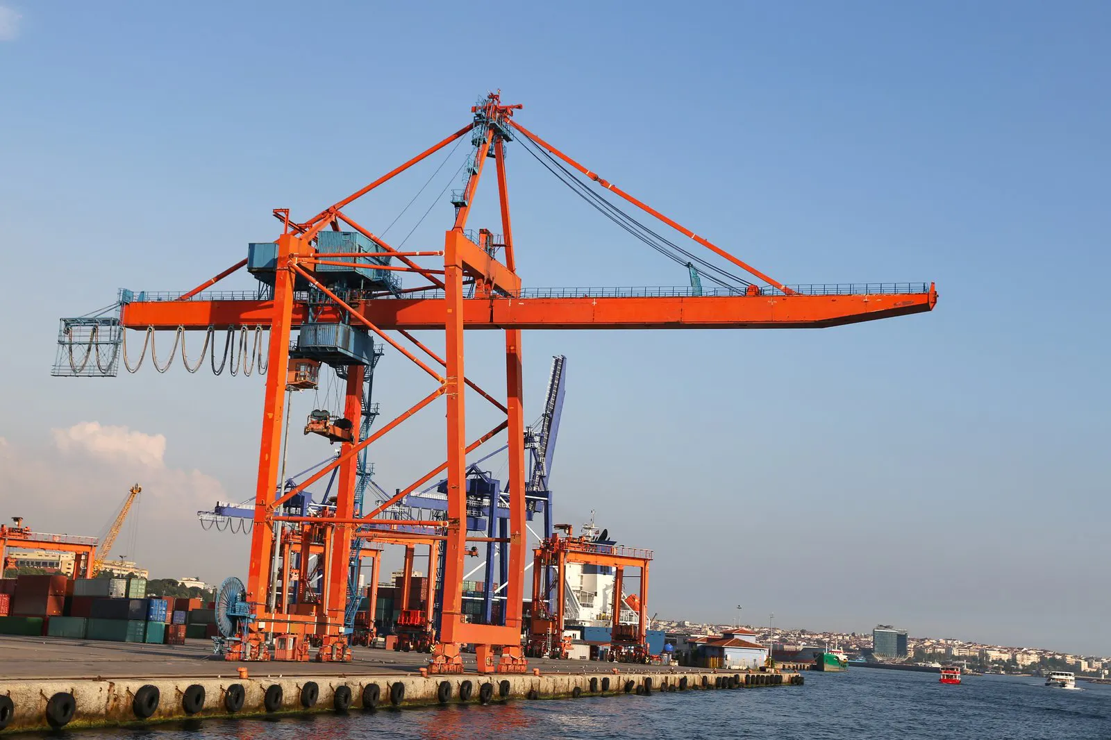 Orange ship-to-shore gantry crane at a container terminal