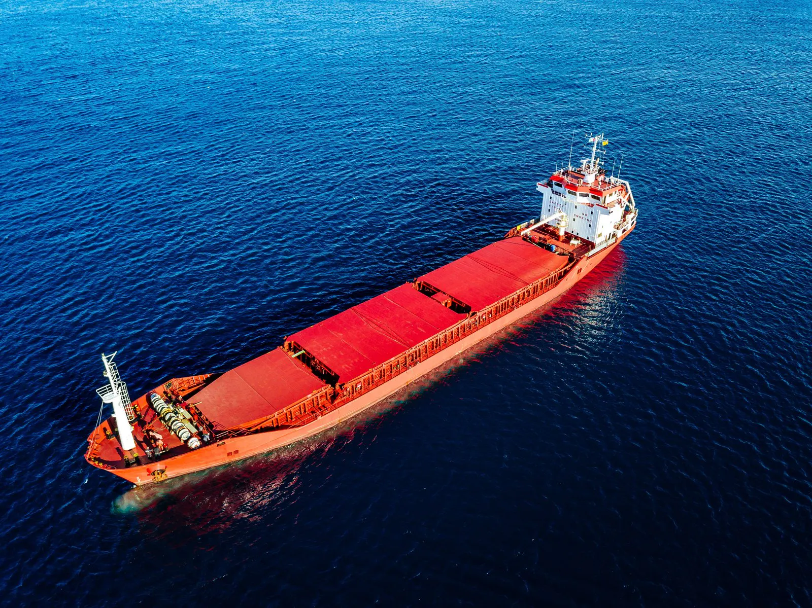 General cargo ship at sea seen from above