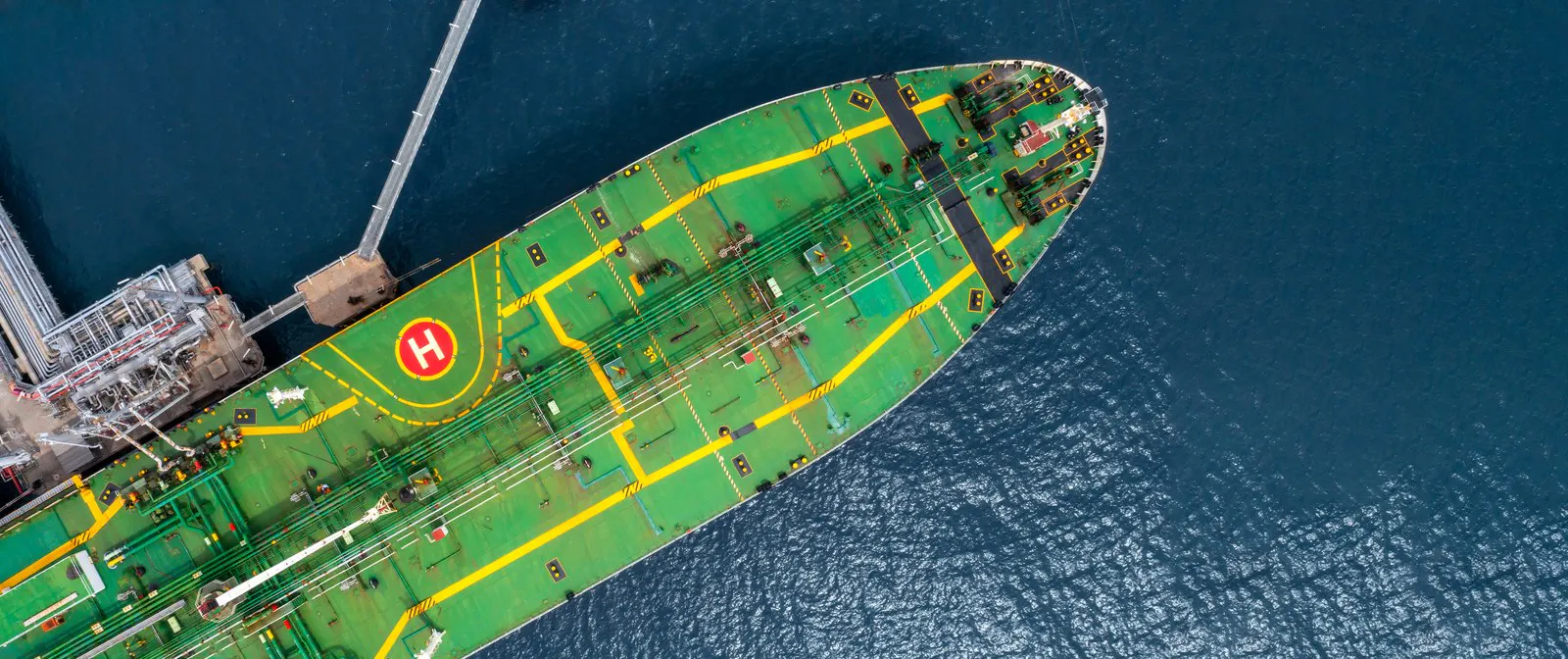Tanker alongside an oil terminal berth seen from the air