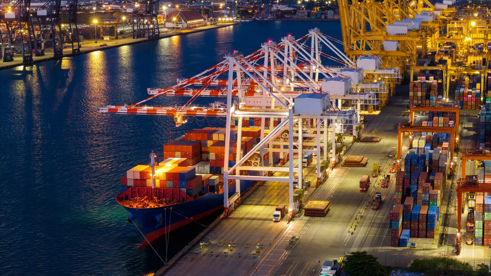 Container ship berthed at a terminal at night