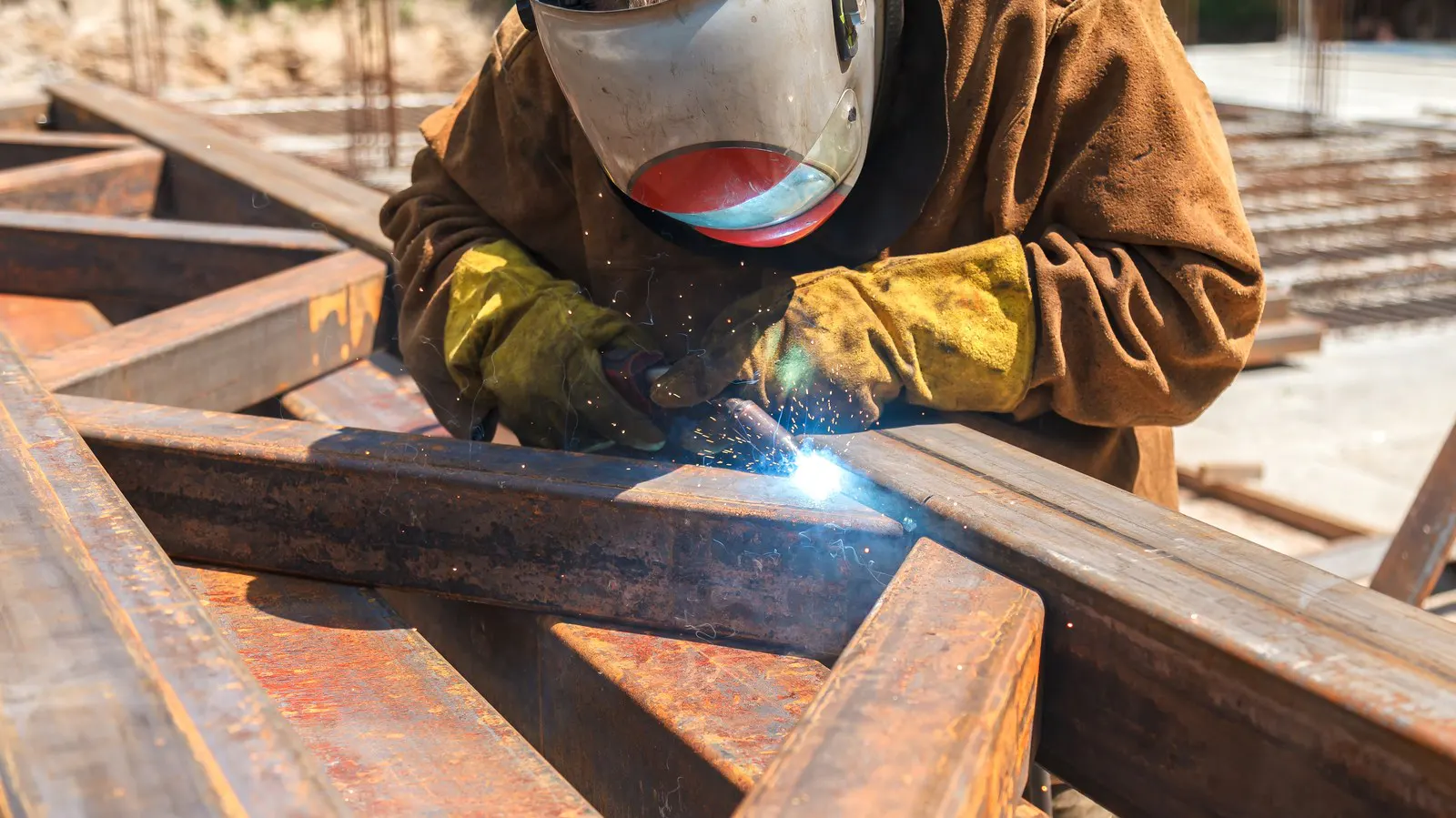 Welder working on heavy steel sections