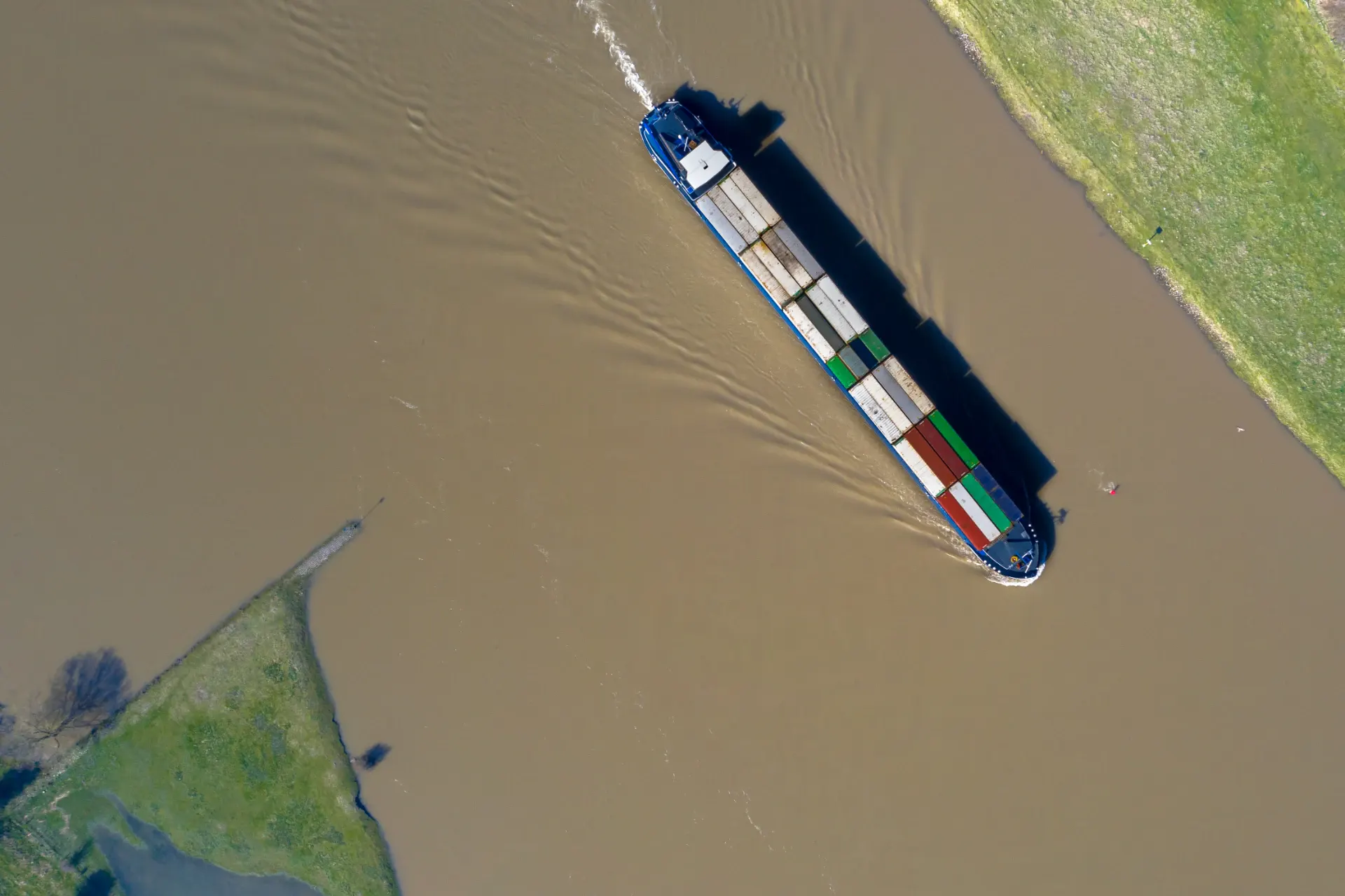 General cargo ship under way on a Dutch inland waterway