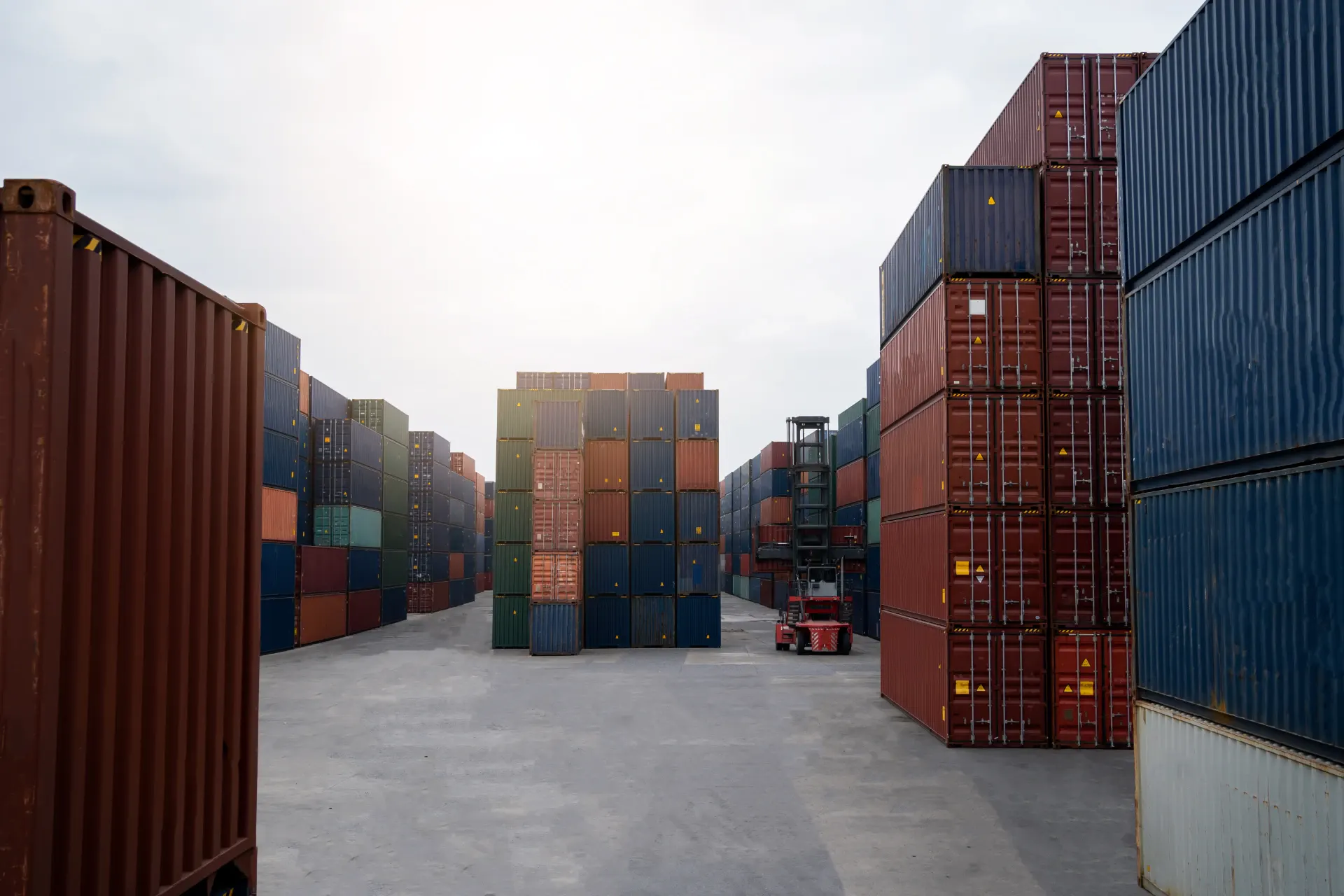 Shipping containers stacked in a terminal yard