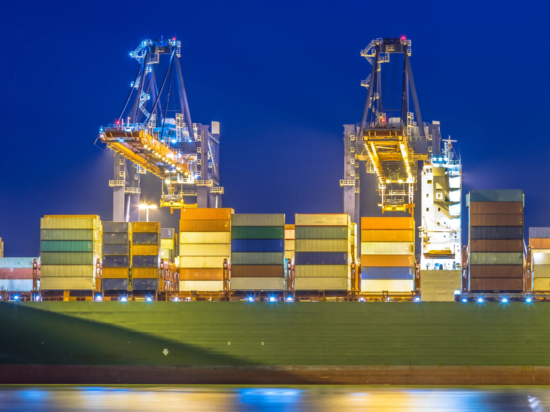 A container ship being worked in an automated terminal