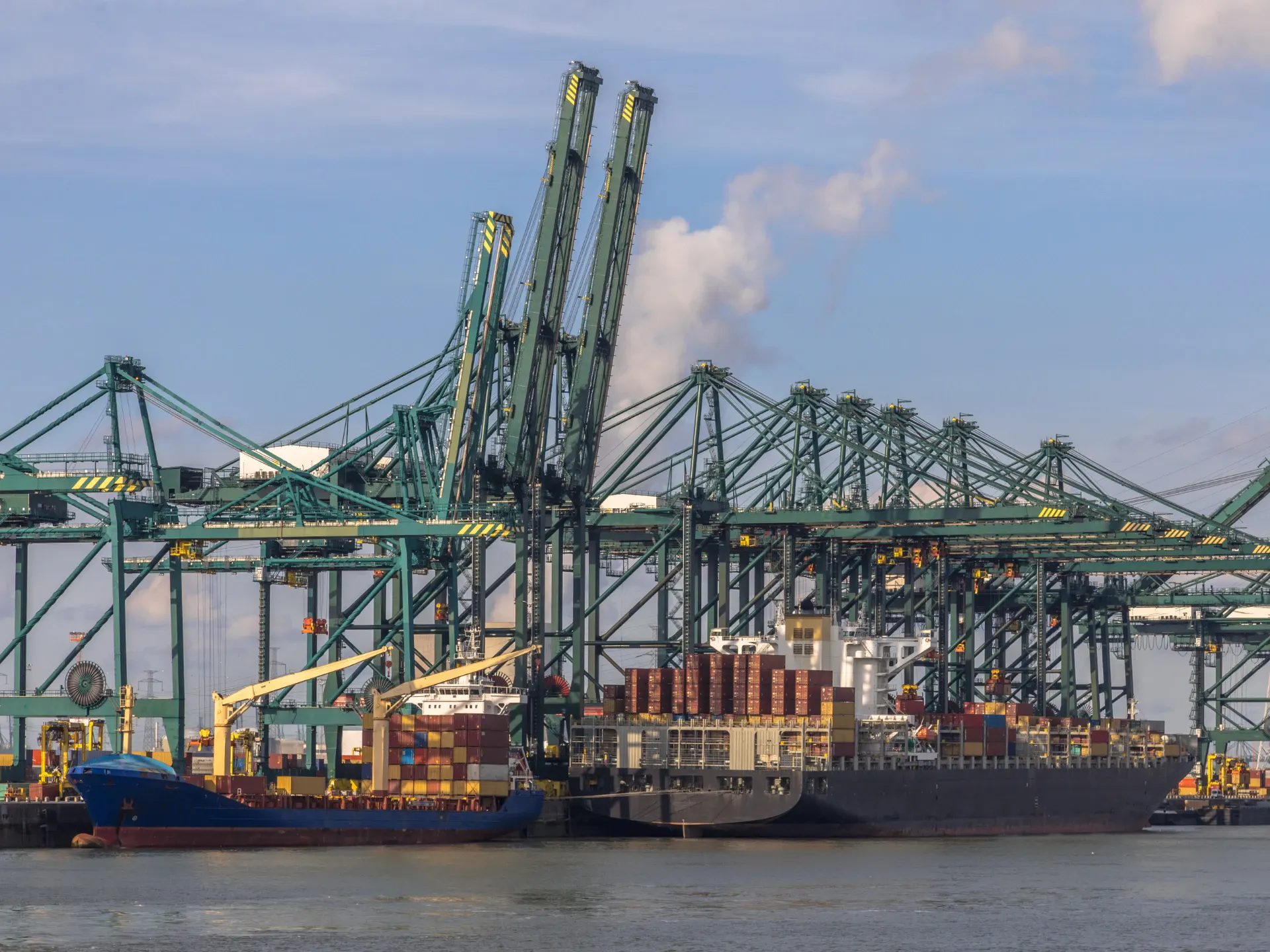 Container ships alongside in a European deep-sea port