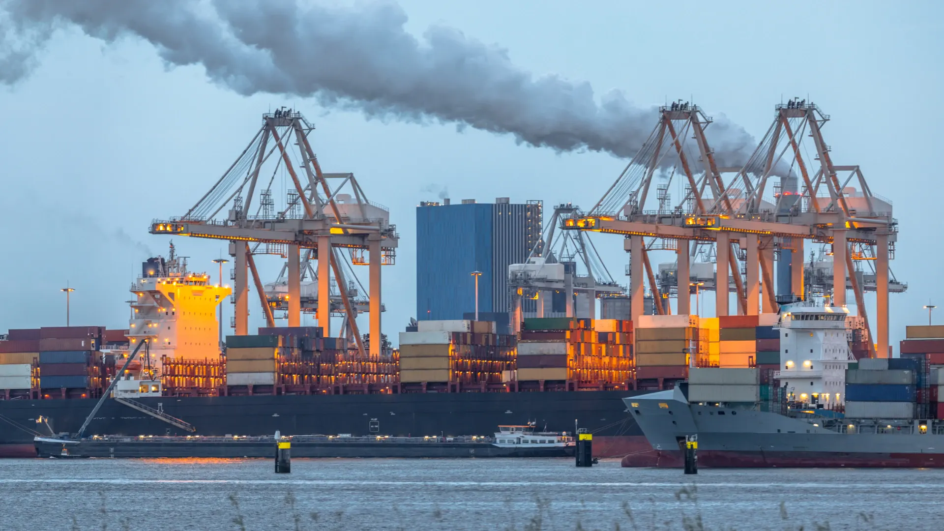 Container ships loading at a port terminal