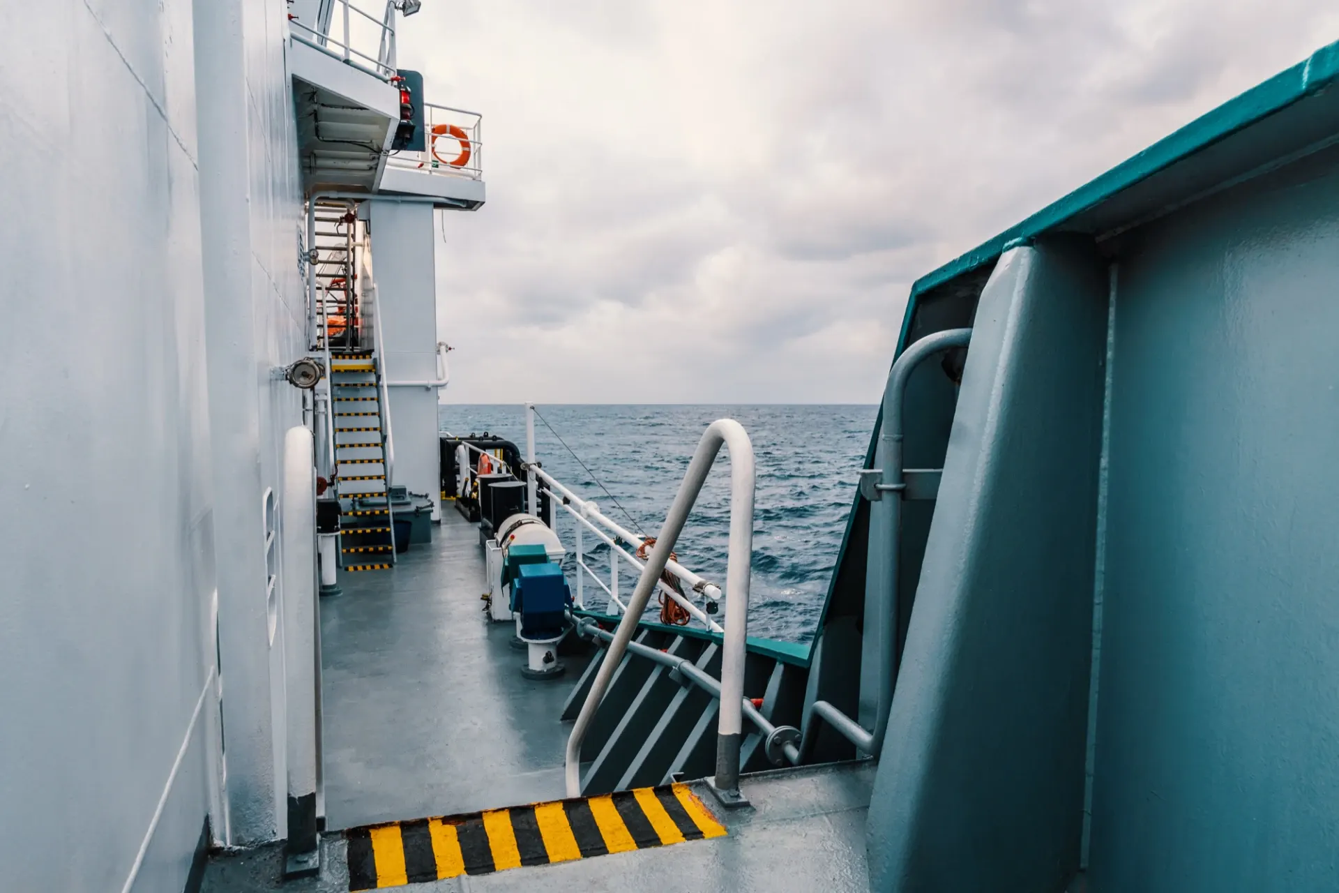 The 85-foot NightTrain floats its boxes aboard through an open centreline bay