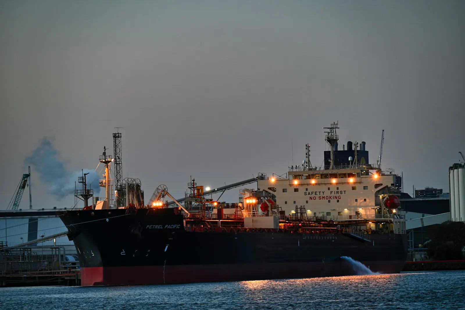 Cargo ship in a harbour at night