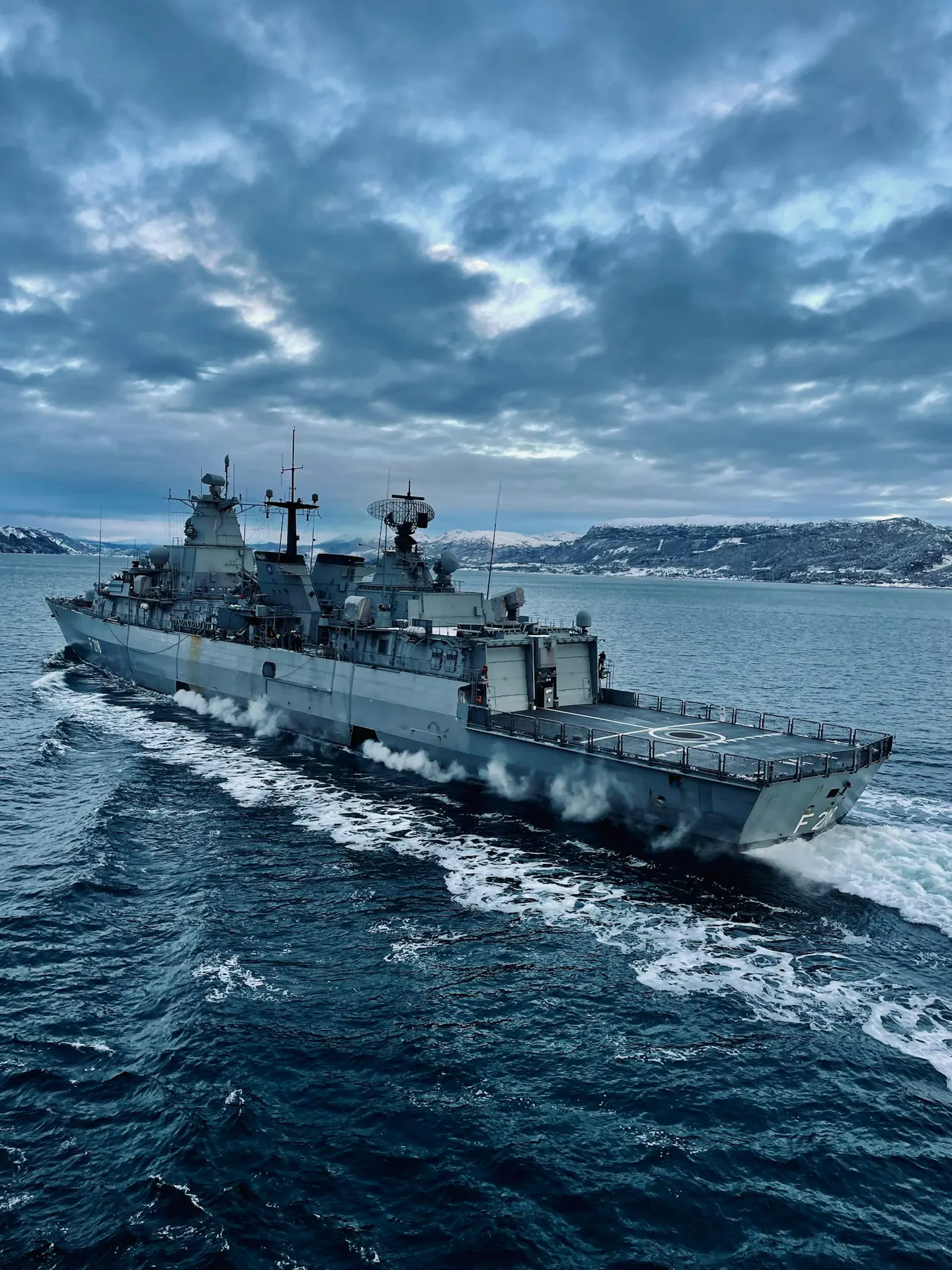 Grey naval warship at sea