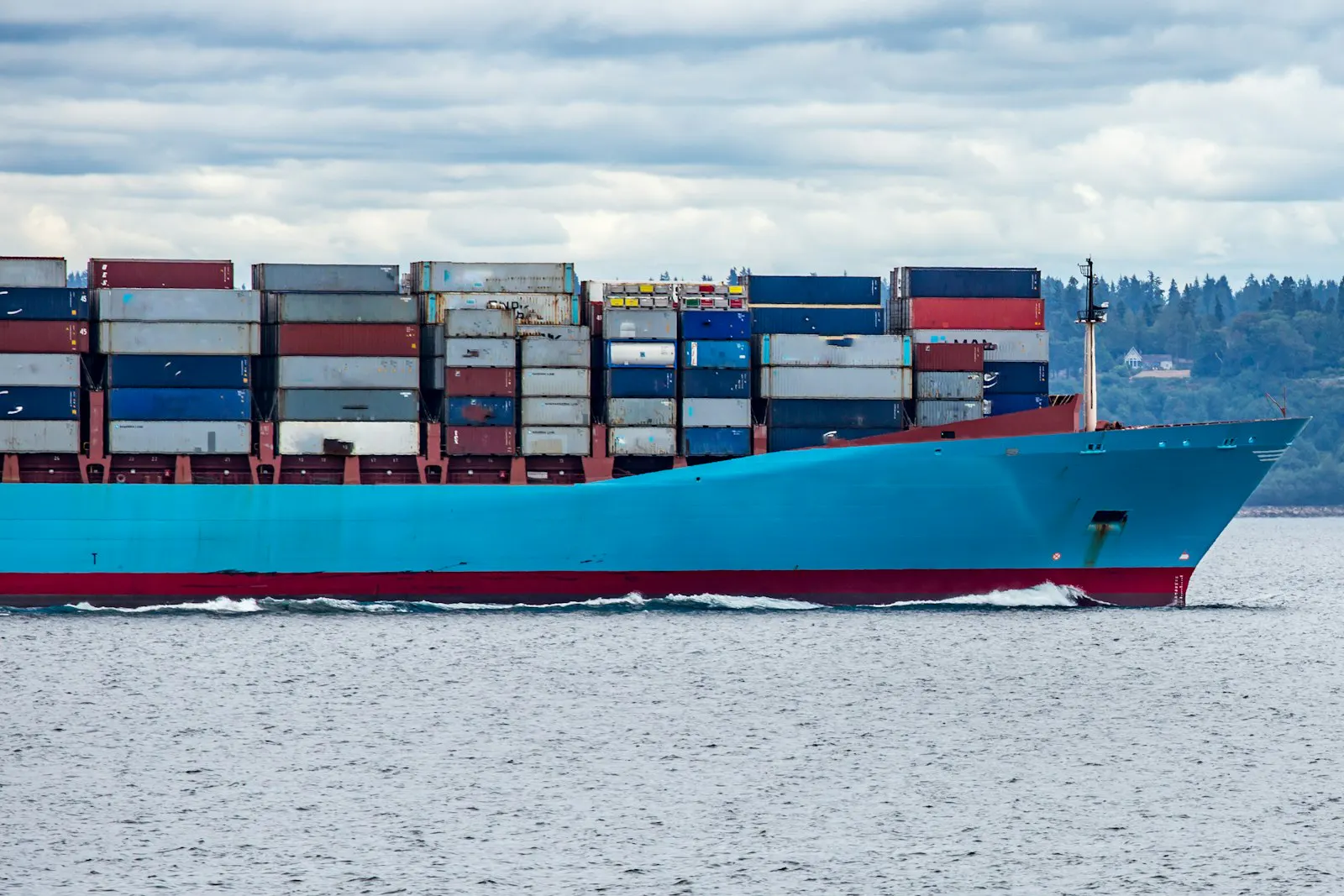 Cargo ship transiting a busy strait