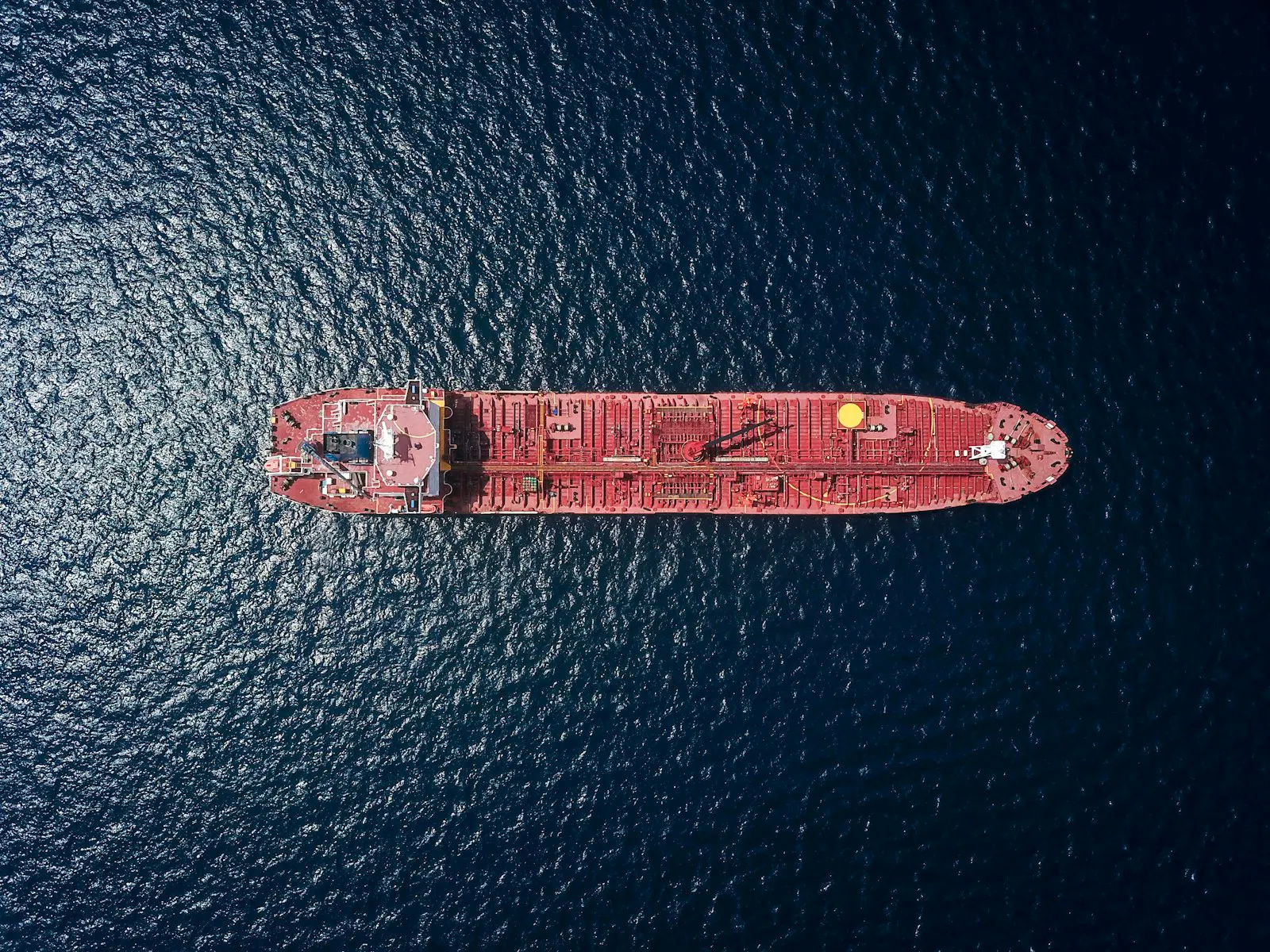 A container ship's fuel bunkering operation at a port terminal